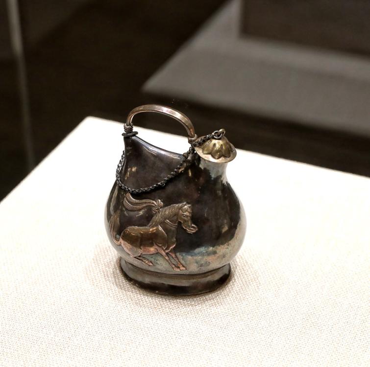 <?php echo strip_tags(addslashes(Tang Dynasty (618-907) silver pot in the shape of a leather bag, which reflects communication and the combination of Han culture and nomadic traditions, Shaanxi History Museum. (Photo provided to China Daily) 
<br><br>
Events provide opportunity to bolster understanding among nations
<br><br>
In 1409, before Chinese admiral Zheng He led his large fleet to distant shores, he asked artisans to make a carved-stone stele in Nanjing, Jiangsu province.
<br><br>
The stele traveled with the flotilla and was left in Sri Lanka as a gift to a local Buddhist temple. Praises for deities in three languages-Chinese, Persian and Tamil-were carved on the stele.
<br><br>
Friendship via the ancient maritime Silk Road was strengthened when the stele was found in 1911 in the southwestern Sri Lankan city of Galle. A replica of the artifact is now in China.
<br><br>
President Xi Jinping, foreign leaders and other dignitaries attending the opening ceremony of the Conference on Dialogue of Asian Civilizations visited an exhibition of cultural relics, which displayed artifacts including the stele, at the China National Convention Center in Beijing on Wednesday.)) ?>