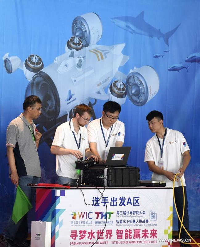 <?php echo strip_tags(addslashes(Team members of Ocean University of China control an underwater robot during the World Intelligence Underwater Robots Challenge held in north China's Tianjin, May 15, 2019. The World Intelligence Underwater Robots Challenge opened here on Wednesday, attracting 13 teams from China, the United States, Japan and Australia. The competition, with the theme 