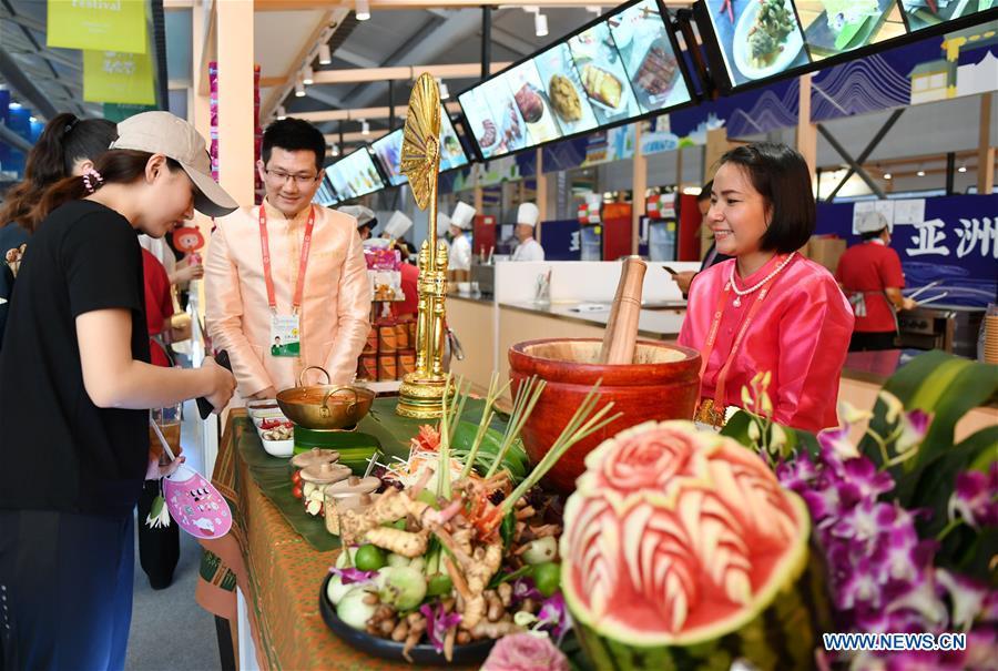 <?php echo strip_tags(addslashes(Visitors view Thai food during the Asian Cuisine Festival at the Olympic Park in Beijing, capital of China, May 16, 2019. The week-long Asian Cuisine Festival, as part of the Conference on Dialogue of Asian Civilizations (CDAC), was held in four cities of Beijing, Hangzhou, Chengdu and Guangzhou. (Xinhua/Zhang Chenlin))) ?>