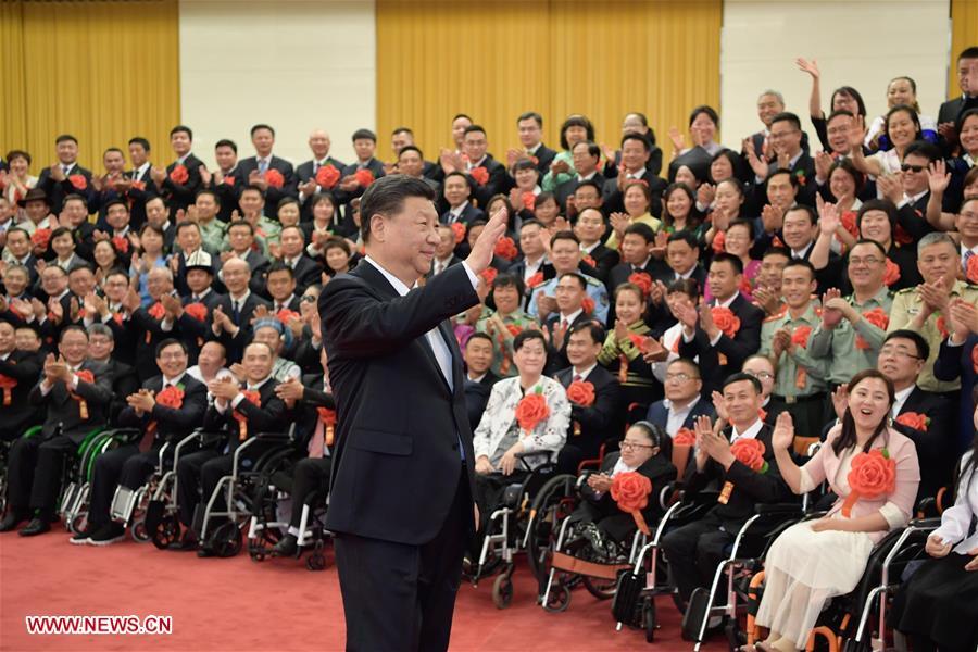 <?php echo strip_tags(addslashes(Chinese President Xi Jinping, also general secretary of the Communist Party of China (CPC) Central Committee and chairman of the Central Military Commission, meets with representatives attending a ceremony commending role models with disabilities and people who have made outstanding contributions in helping the disabled, at the Great Hall of the People in Beijing, capital of China, May 16, 2019. Premier Li Keqiang and Wang Huning, a member of the Secretariat of the CPC Central Committee, both members of the Standing Committee of the Political Bureau of the CPC Central Committee, also met with the representatives. (Xinhua/Li Xueren))) ?>