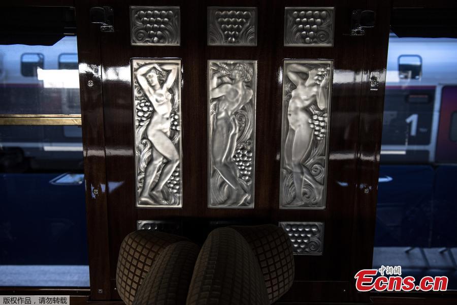 <?php echo strip_tags(addslashes(This picture taken on May 13, 2019 shows a glass triptych of naiads dancing created by French glass designer Rene Lalique in a restored carriage of an Orient Express train at Gare de l'Est train station in Paris. (Photo/Agencies))) ?>