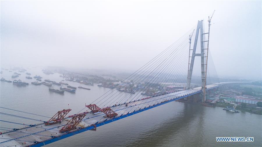 <?php echo strip_tags(addslashes(Aerial photo taken on May 16, 2019 shows the closure scene of Qingshan Yangtze River Bridge in Wuhan, central China's Hubei Province. The 7,548 meter-long Qingshan Yangtze River Bridge is now the widest bridge over Yangtze River. (Xinhua/Xiao Yijiu))) ?>