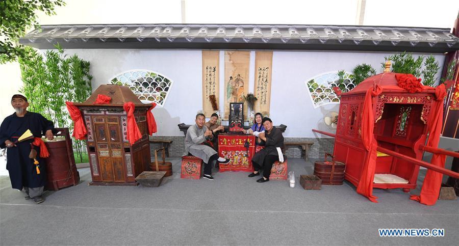 Folk arts are displayed during the Asian Cuisine Festival at the Olympic Park in Beijing, capital of China, May 16, 2019. The week-long Asian Cuisine Festival, as part of the Conference on Dialogue of Asian Civilizations (CDAC), was held in four cities of Beijing, Hangzhou, Chengdu and Guangzhou. (Xinhua/Wang Yuguo)