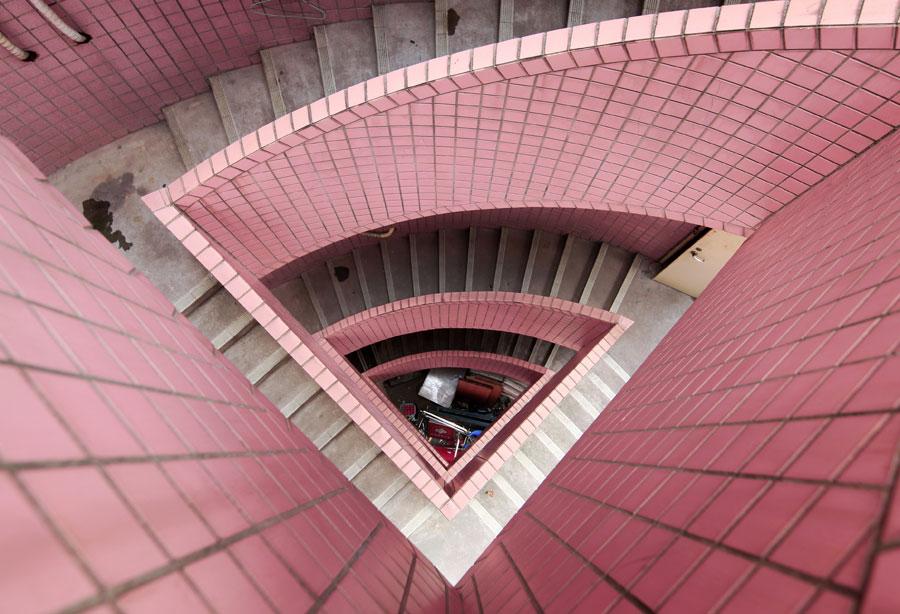 <?php echo strip_tags(addslashes(Li Zhenhui, an employee with an interior design company in Guangzhou, has shot photos of more than 400 sets of winding stairs in the city. (Photo by Li Zhenhui/for chinadaily.com.cn))) ?>