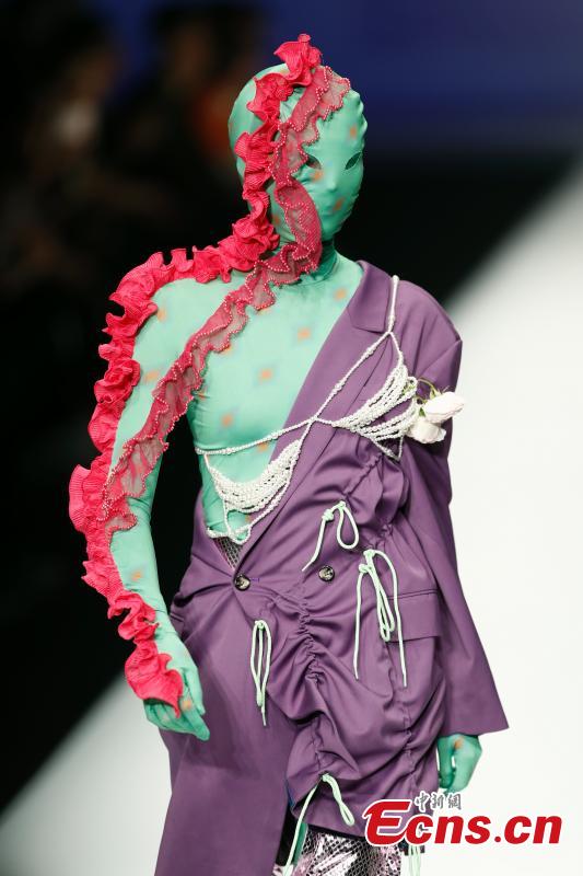 A model wears a creation by a newcomer designer during the China Graduate Fashion Week in Beijing, May 19, 2019. The seven-day event concluded on Sunday night, with the announcement of ten winning newcomer designers. (Photo: China News Service/Sheng Jiapeng)