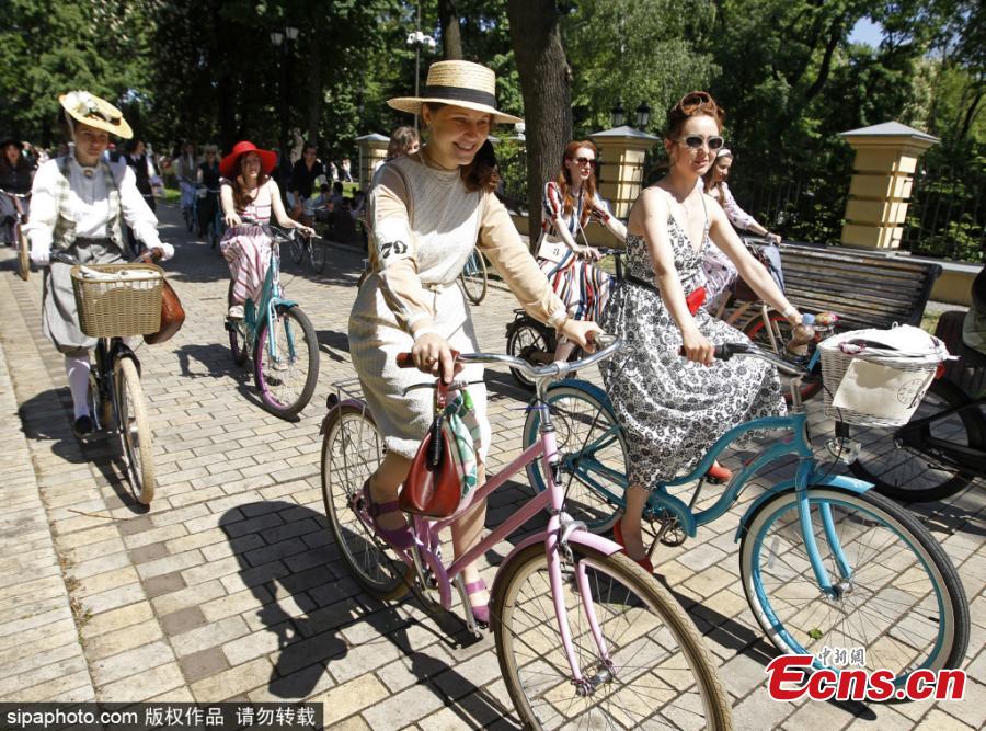 Participants with their bikes wearing vintage clothes attend Retro Cruise 2019, a retro parade on bicycles, similar of the known Tweed Run bike ride, in center of Kiev, Ukraine, on 19 May 2019.(Photo/Sipaphoto)