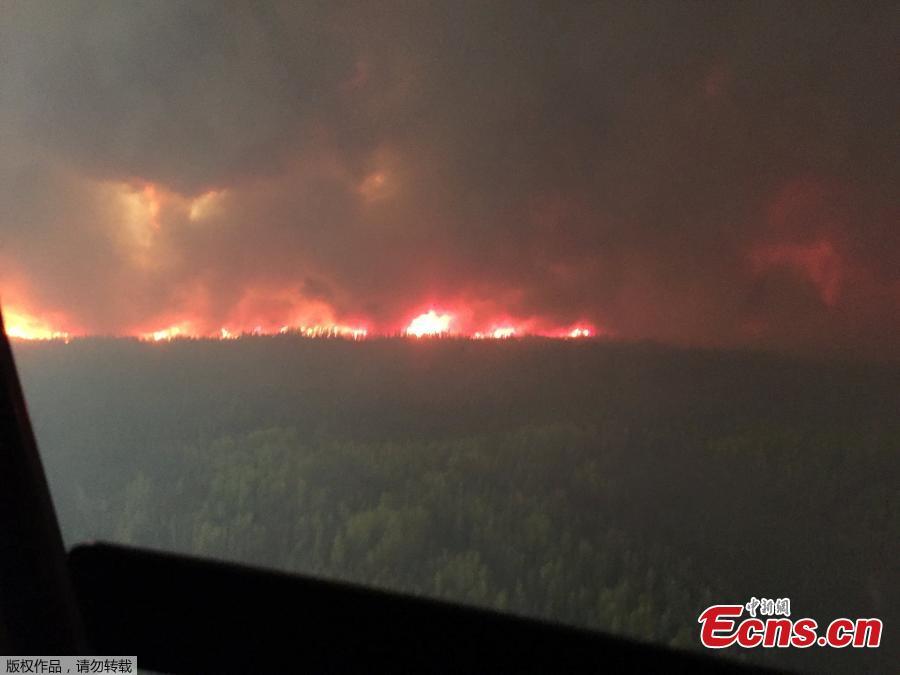 <?php echo strip_tags(addslashes(The Chuckegg Creek wildfire burns out of control in the High Level Forest Area, to the southwest and west of the town of High Level, Alberta, Canada in this May 19, 2019 picture obtained from social media. (Photo/Agencies))) ?>