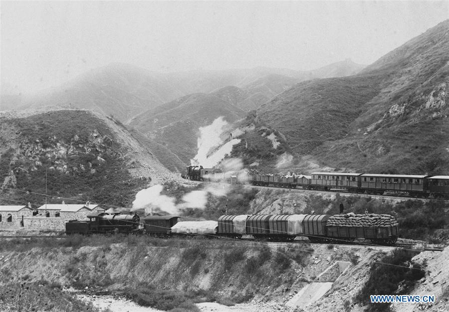 This undated file photo shows trains running on the zigzag upward railways of Beijing-Zhangjiakou railway that overcomed the gradient problem by switching back the line near the station of Qinglongqiao in Yanqing District, Beijing, capital of China. (Xinhua)