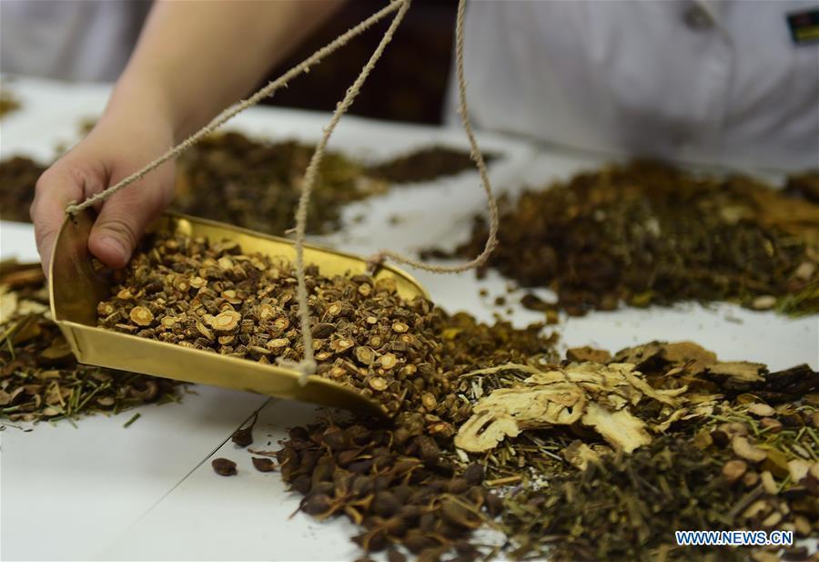 <?php echo strip_tags(addslashes(A staff member of Cangzhou People's Hospital fills prescriptions of Traditional Chinese Medicine for patients in Cangzhou, north China's Hebei Province, May 26, 2019. Traditional medicine originating from Traditional Chinese Medicine (TCM) has been incorporated into the 11th revision of the International Classification of Diseases (ICD), marking a major step for TCM's internationalization. The revision was approved Saturday at the 72 World Health Assembly being held in Geneva, Switzerland, according to China's National Administration of Traditional Chinese Medicine. (Xinhua/Fu Xinchun))) ?>