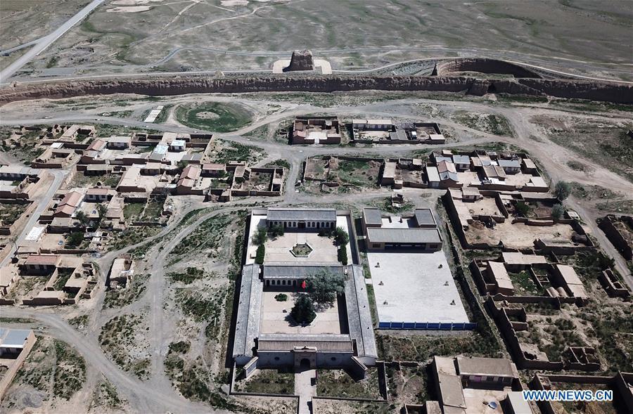 <?php echo strip_tags(addslashes(Aerial photo taken on May 28, 2019 shows a view of the Yongtai ancient city in Jingtai County of Baiyin, northwest China's Gansu Province. Construction of the Yongtai ancient city began in the early 17th century and the complex used to be a military fortress. Girdled by 12-meter wall structures totaling 1.7 kilometers in length, the Yongtai ancient city looks like a turtle when seen from above and is thus dubbed 