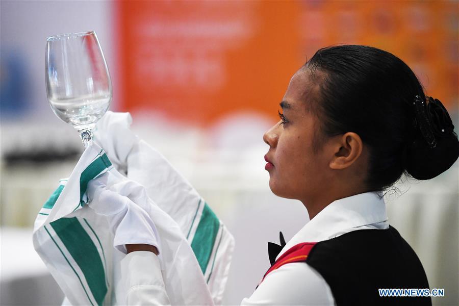 A contestant participates in the restaurant service competition during the Belt And Road International Skills Competition held in Chongqing International Expo Center in Chongqing, southwest China, May 29, 2019. (Xinhua/Wang Quanchao)