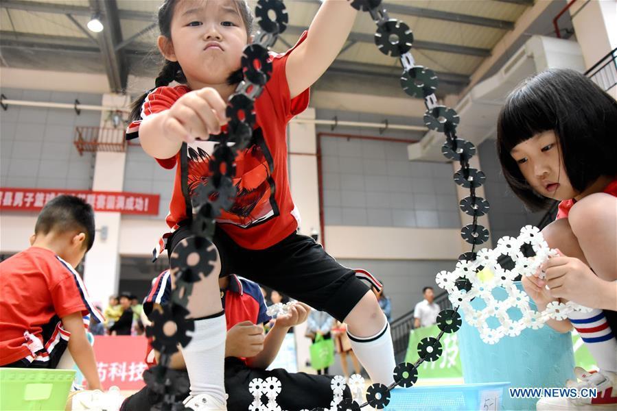 <?php echo strip_tags(addslashes(Children participate in a competition in celebration of the upcoming International Children's Day at Chunhui Kindergarten in Xianju County of Taizhou City, east China's Zhejiang Province, May 29, 2019. (Xinhua/Wang Huabin))) ?>