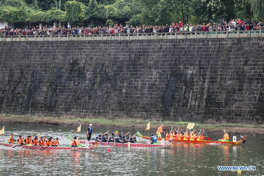 <?php echo strip_tags(addslashes(Contestants take part in a dragon boat race held on the Yujiang River as part of the traditional folk customs to celebrate the upcoming Duanwu Festival in Changning County of Yibin, southwest China's Sichuan Province, May 29, 2019. Duanwu Festival is traditionally celebrated on the fifth day of the fifth month on Chinese lunar calendar. (Xinhua/Zhuang Geer))) ?>