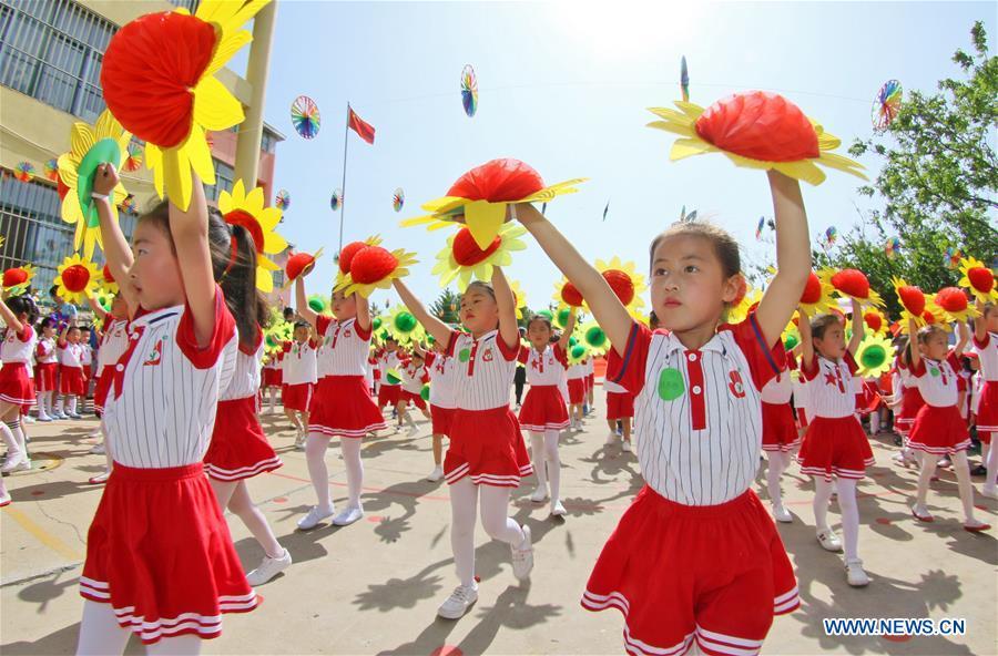 Children perform during an activity in celebration of the upcoming International Children\'s Day at a kindergarten in Yantai City, east China\'s Shandong Province, May 29, 2019. (Xinhua/Tang Ke)