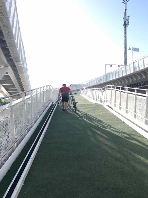<?php echo strip_tags(addslashes(A cyclist walks with his bike up the slope on the first bicycle-only lane in Beijing, May 31, 2019.  (Photo/chinadaily.com.cn))) ?>