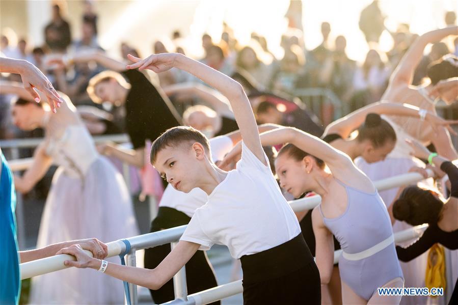 Dancers take part in a ballet master class by Nikolay Tsiskaridze during The World Ballet Holidays Festival in Moscow, Russia, on June 1, 2019. The World Ballet Holidays Festival is held from May 31 to June 2 at VDNH exhibition complex in Moscow. One of the highlights of the festival is an outdoor ballet class conducted by ballet dancer Nikolay Tsiskaridze. (Xinhua/Maxim Chernavsky)