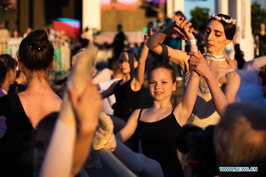 Dancers take part in a ballet master class by Nikolay Tsiskaridze during The World Ballet Holidays Festival in Moscow, Russia, on June 1, 2019. The World Ballet Holidays Festival is held from May 31 to June 2 at VDNH exhibition complex in Moscow. One of the highlights of the festival is an outdoor ballet class conducted by ballet dancer Nikolay Tsiskaridze. (Xinhua/Maxim Chernavsky)