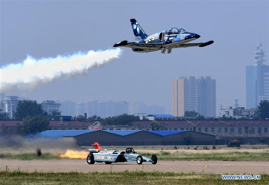 <?php echo strip_tags(addslashes(An enthusiast flying a small plane competes for speed with a racer during the opening of the 11th Air Sports Culture and Tourism Festival in Anyang, central China's Henan Province, June 3, 2019. The event kicked off Monday in the city of Anyang, attracting air sports fans from home and abroad. (Xinhua/Li An))) ?>