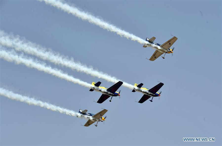 Enthusiasts in air sports give an aerobatic show during the opening of the 11th Air Sports Culture and Tourism Festival in Anyang, central China\'s Henan Province, June 3, 2019. The event kicked off Monday in the city of Anyang, attracting air sports fans from home and abroad. (Xinhua/Li Jianan)
