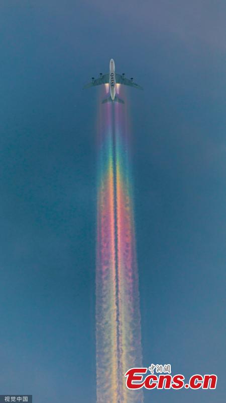 <?php echo strip_tags(addslashes(A Qatar Airways plane was caught brightening up the skies with a spectacular rainbow trail from its wings. The aircraft was spotted emitting the incredible multi-coloured clouds, also known as a rainbow contrail, as it flew over Bamberg, Germany. (Photo/VCG))) ?>