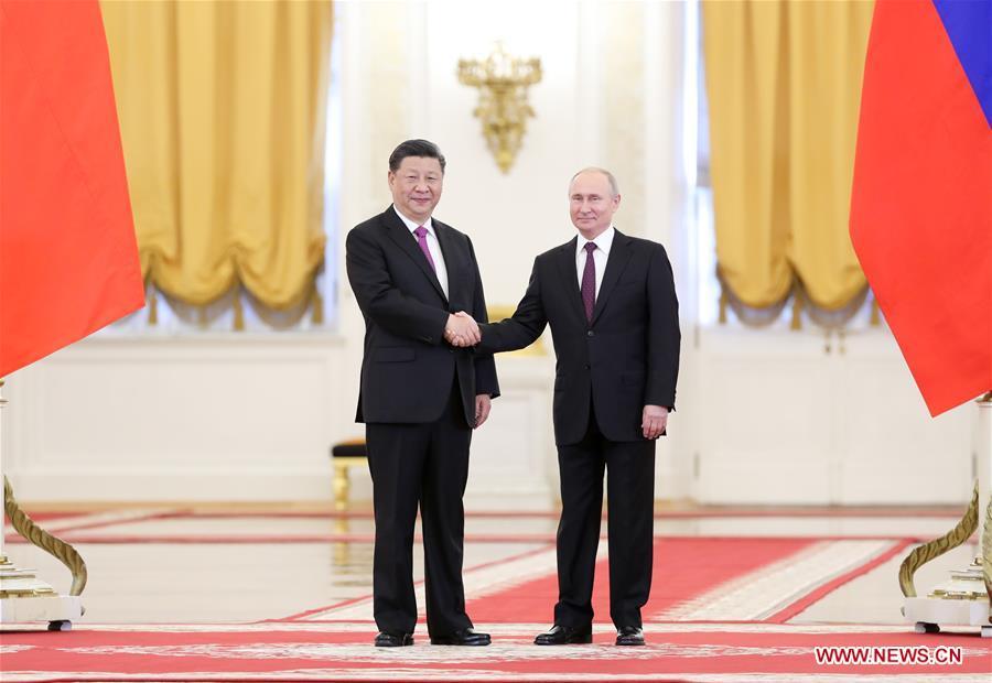 <?php echo strip_tags(addslashes(Chinese President Xi Jinping (L) shakes hands with his Russian counterpart Vladimir Putin while posing for photos ahead of their talks in Moscow, Russia, June 5, 2019. Xi Jinping held talks with Vladimir Putin at the Kremlin in Moscow on Wednesday. (Xinhua/Ding Haitao))) ?>