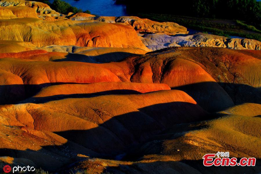 The photo taken on June 5, 2019 shows Wucaitan, also known as the Rainbow Beach in Burqin county, Altay Prefecture, northwest China\'s Xinjiang Uyghur Autonomous Region. The beach is known for its unique landforms created by years of wind and water erosion. (Photo/IC)