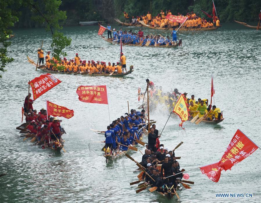 <?php echo strip_tags(addslashes(People participate in a dragon boat race in Jinjiang River in Tongren City, southwest China's Guizhou Province, June 5, 2019. A dragon boat championship was held in Tongren on Wednesday to celebrate the upcoming Dragon Boat Festival, which falls on June 7 this year. (Xinhua/Long Yuanbin))) ?>