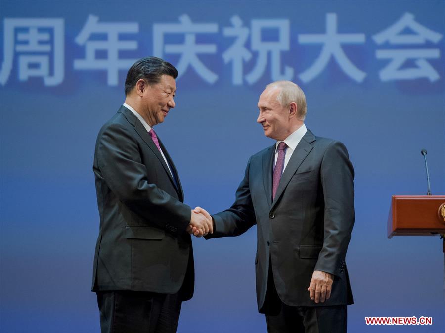 Chinese President Xi Jinping (L) and his Russian counterpart Vladimir Putin attend a gathering marking the 70th anniversary of the establishment of the China-Russia diplomatic relations at the Bolshoi Theater of Russia in Moscow June 5, 2019. (Xinhua/Li Xueren)