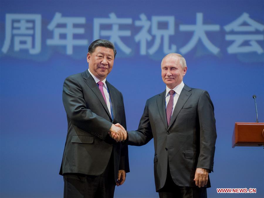 Chinese President Xi Jinping (L) and his Russian counterpart Vladimir Putin attend a gathering marking the 70th anniversary of the establishment of the China-Russia diplomatic relations at the Bolshoi Theater of Russia in Moscow June 5, 2019. (Xinhua/Li Xueren)