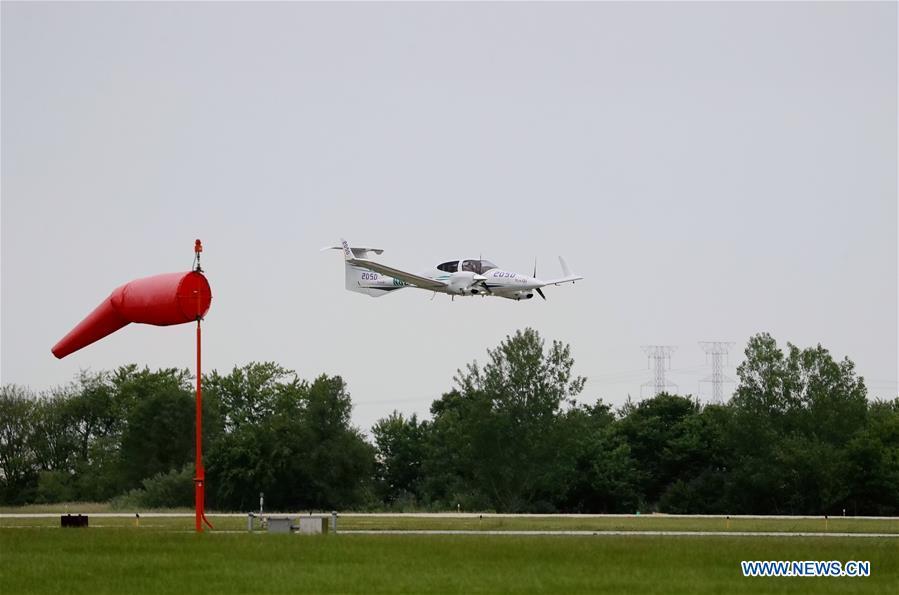 <?php echo strip_tags(addslashes(The Diamond DA42 aircraft which Zhang Bo drove for his flight around the world lands at an airport in Chicago, the United States, on June 9, 2019. After flying 68 days and making 50 stops, 57-year-old Bo Zhang completed his second around-the-world flight and landed in Chicago on Sunday morning. On April 2, Zhang kicked off the flight in the same airport in Chicago. In 68 days, he flied through 21 countries in three continents and over three oceans, with total mileage reaching 41,000 kilometers. (Xinhua/Wang Ping))) ?>