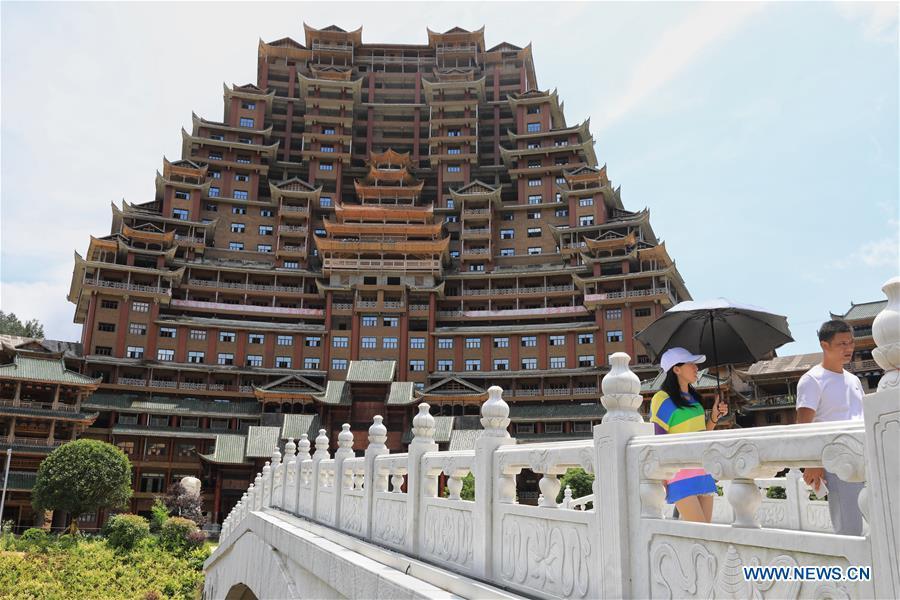 A wooden building of Shui ethnic group is seen in Yingshan Town of Dushan County, southwest China\'s Guizhou Province, June 7, 2019. The 24-story, 99.9-meter-high traditional Shui-style wooden building in Dushan is of \