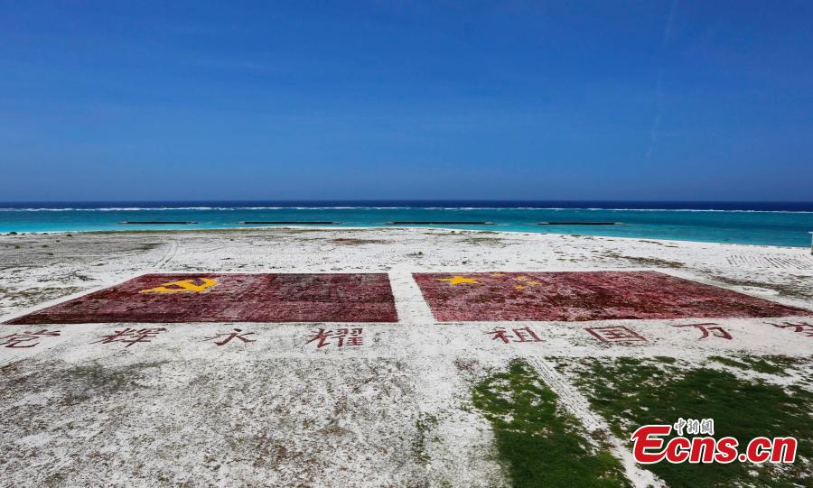 PLA Navy soldiers work on Zhongjian Island of Xisha Islands in South China Sea, Hainan Province. Over dozens of years, soldiers have transformed the barren site into a lush area despite the harsh environment of high temperatures, high humidity, high salt and lack of fresh water. (Photo: China News Service/Wang Xiaobin)