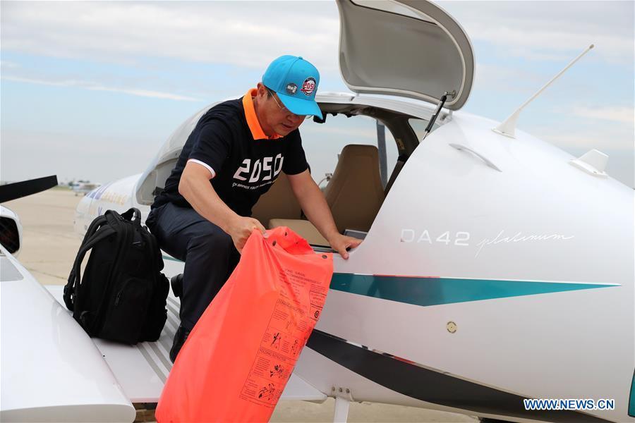 <?php echo strip_tags(addslashes(Zhang Bo unloads an immersion suit from his plane at an airport in Chicago, the United States, on June 9, 2019. After flying 68 days and making 50 stops, 57-year-old Bo Zhang completed his second around-the-world flight and landed in Chicago on Sunday morning. On April 2, Zhang kicked off the flight in the same airport in Chicago. In 68 days, he flied through 21 countries in three continents and over three oceans, with total mileage reaching 41,000 kilometers. (Xinhua/Wang Ping))) ?>