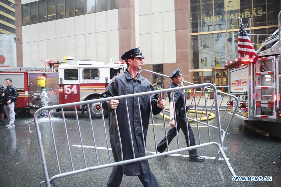 <?php echo strip_tags(addslashes(Police officers set up fences near the building where a helicopter crashed in Manhattan, New York, the United States, June 10, 2019. One person was killed after a helicopter crashed onto the roof of a skyscraper in Midtown Manhattan of New York City Monday afternoon, according to media reports. (Xinhua/Wang Ying))) ?>