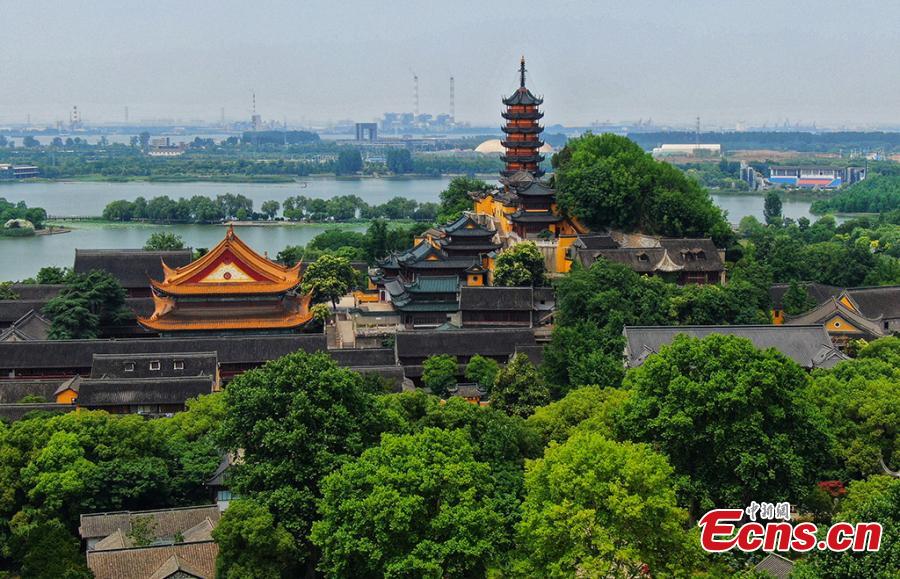 <?php echo strip_tags(addslashes(An aerial view of the Jinshan Park in Zhenjiang City, Jiangsu Province, June 11, 2019. The park is home to Jinshan Temple, a famous Buddhist temple built on a mountain to the south of the Yangtze River. (Photo: China News Service/Yang Bo))) ?>