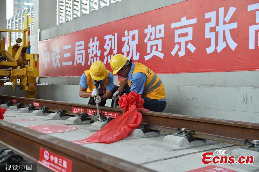 <?php echo strip_tags(addslashes(The entire track-laying construction for the Beijing-Zhangjiakou high-speed railway was completed on June 12, 2019. The railway is 174 kilometers long, which is an important traffic guarantee measure for the Beijing Winter Olympic Games in 2022. After completion, the time from Beijing to Zhangjiakou by train will be shortened from three hours to less than one hour, which is of great significance for promoting the coordinated development of Beijing, Tianjin and Hebei and also connecting the western region.(Photo/VCG))) ?>