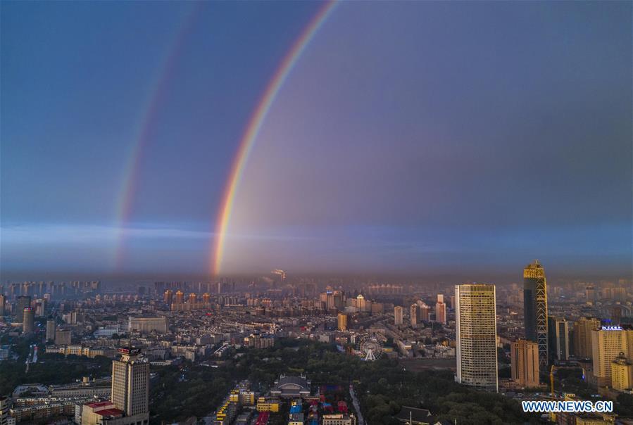Aerial photo shows double rainbow arching across Changchun City, northeast China\'s Jilin Province, on June 11, 2019. A double rainbow brightened the sky over Changchun City after a strong rainfall hit the city. (Xinhua/Xu Chang)
