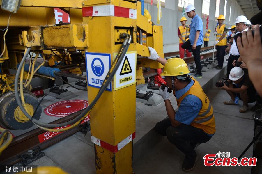 <?php echo strip_tags(addslashes(The entire track-laying construction for the Beijing-Zhangjiakou high-speed railway was completed on June 12, 2019. The railway is 174 kilometers long, which is an important traffic guarantee measure for the Beijing Winter Olympic Games in 2022. After completion, the time from Beijing to Zhangjiakou by train will be shortened from three hours to less than one hour, which is of great significance for promoting the coordinated development of Beijing, Tianjin and Hebei and also connecting the western region.(Photo/VCG))) ?>