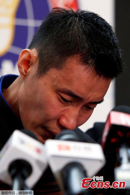 <?php echo strip_tags(addslashes(Malaysia's badminton player Lee Chong Wei reacts during a news conference to announce his retirement in Putrajaya, Malaysia June 13, 2019. (Photo/Agencies))) ?>