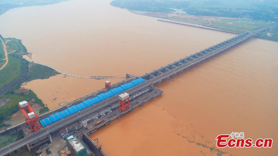 <?php echo strip_tags(addslashes(After days of strong rain, the Ganjiang River is in flood in Taihe County, East China’s Jiangxi Province, June 12, 2019. Parks and fields in the county were submerged, while roads were closed and electricity supplies cut. (Photo: China News Service/Deng Heping))) ?>