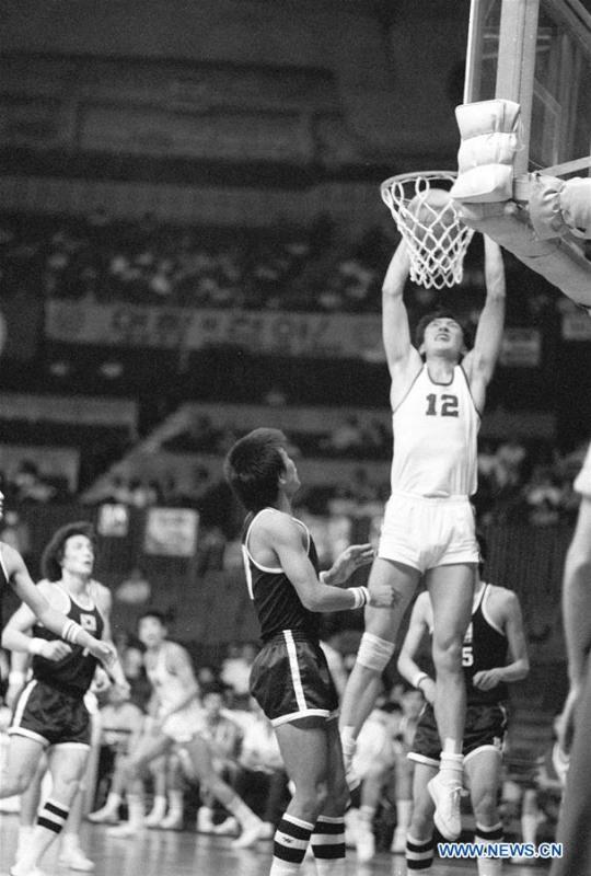 Xing Weining of China competes during a game against the Democratic People\'s Republic of Korea at the 8th FIBA World Basketball Championships in Manila, the Philipines in October 1978. It was the first time China took part in the event and finished 11th. This year marks the 70th anniversary of the founding of the People\'s Republic of China (PRC). On April 5, 1959, Rong Guotuan won the champion of the men\'s singles event at the 25th ITTF World Table Tennis Championships in Dortmund, Germany, becoming China\'s first ever world champion. Chinese players have made more achievements during the 60 years since then. (Xinhua/Wang Daoyuan)