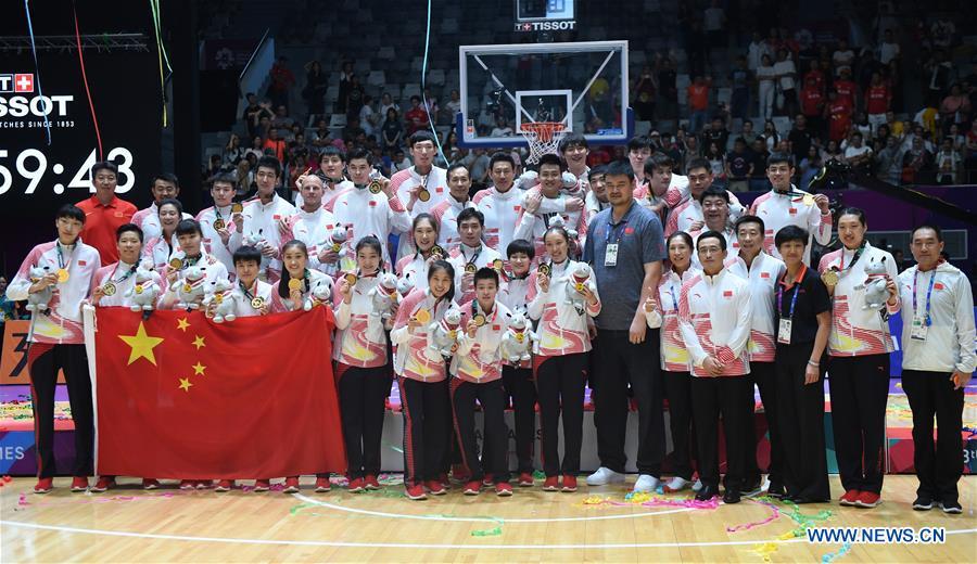<?php echo strip_tags(addslashes(Members of the men's and women's basketball teams of China pose for photo after winning both men's and women's titles at the 18th Asian Games in Jakarta, Indonesia, Sept. 1, 2018. This year marks the 70th anniversary of the founding of the People's Republic of China (PRC). On April 5, 1959, Rong Guotuan won the champion of the men's singles event at the 25th ITTF World Table Tennis Championships in Dortmund, Germany, becoming China's first ever world champion. Chinese players have made more achievements during the 60 years since then. (Xinhua/Huang Zongzhi))) ?>