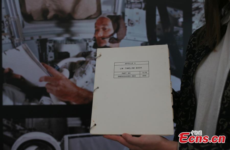 The Apollo 11 Lunar Module Timeline Book, which will be up for auction on July 18 at Christie\'s in New York, fifty years after the historic space mission in 1969, is photographed in Beijing, June 13, 2019. The book, estimated to be worth $7-9 million, was a key component of achieving the goal of placing man on the moon and returning him safely to earth. The Timeline Book will be the star lot offered within the auction, One Giant Leap: Celebrating Space Exploration 50 Years after Apollo 11, which will include more than 150 lots of space history artefacts. (Photo: China News Service/Yang Kejia)