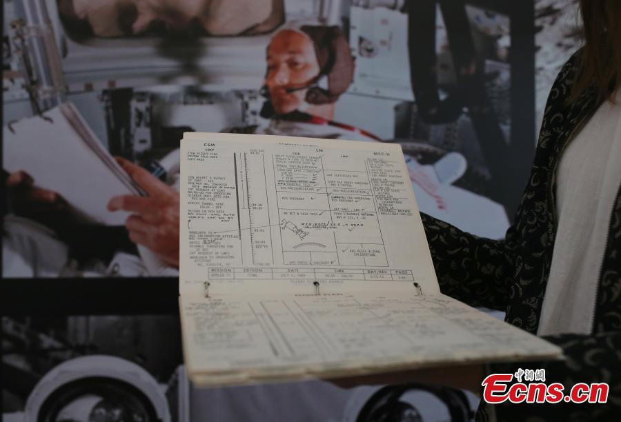 The Apollo 11 Lunar Module Timeline Book, which will be up for auction on July 18 at Christie\'s in New York, fifty years after the historic space mission in 1969, is photographed in Beijing, June 13, 2019. The book, estimated to be worth $7-9 million, was a key component of achieving the goal of placing man on the moon and returning him safely to earth. The Timeline Book will be the star lot offered within the auction, One Giant Leap: Celebrating Space Exploration 50 Years after Apollo 11, which will include more than 150 lots of space history artefacts. (Photo: China News Service/Yang Kejia)