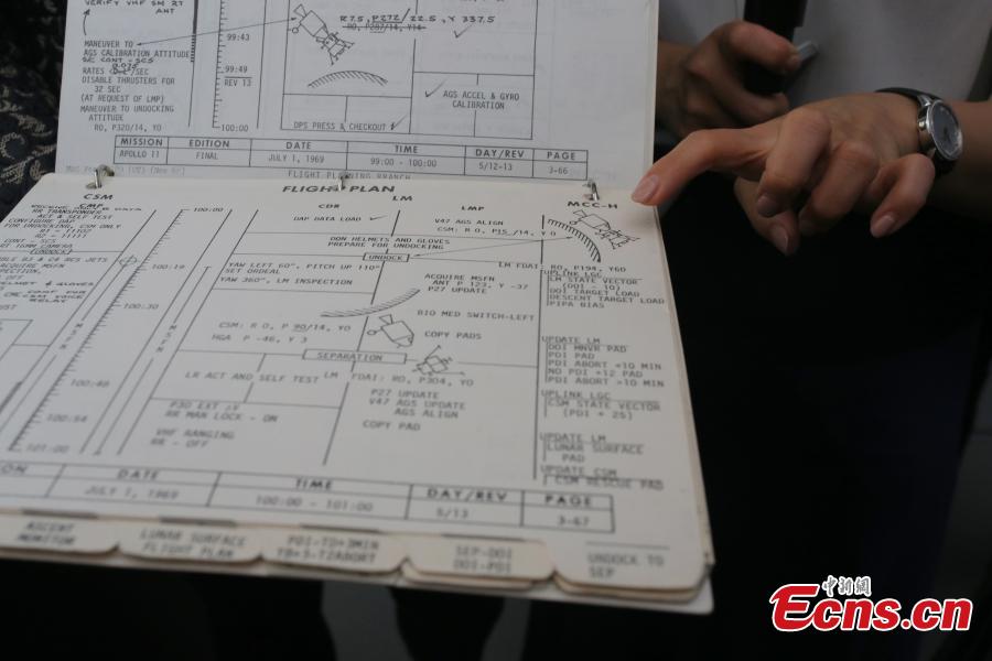 The Apollo 11 Lunar Module Timeline Book, which will be up for auction on July 18 at Christie\'s in New York, fifty years after the historic space mission in 1969, is photographed in Beijing, June 13, 2019. The book, estimated to be worth $7-9 million, was a key component of achieving the goal of placing man on the moon and returning him safely to earth. The Timeline Book will be the star lot offered within the auction, One Giant Leap: Celebrating Space Exploration 50 Years after Apollo 11, which will include more than 150 lots of space history artefacts. (Photo: China News Service/Yang Kejia)