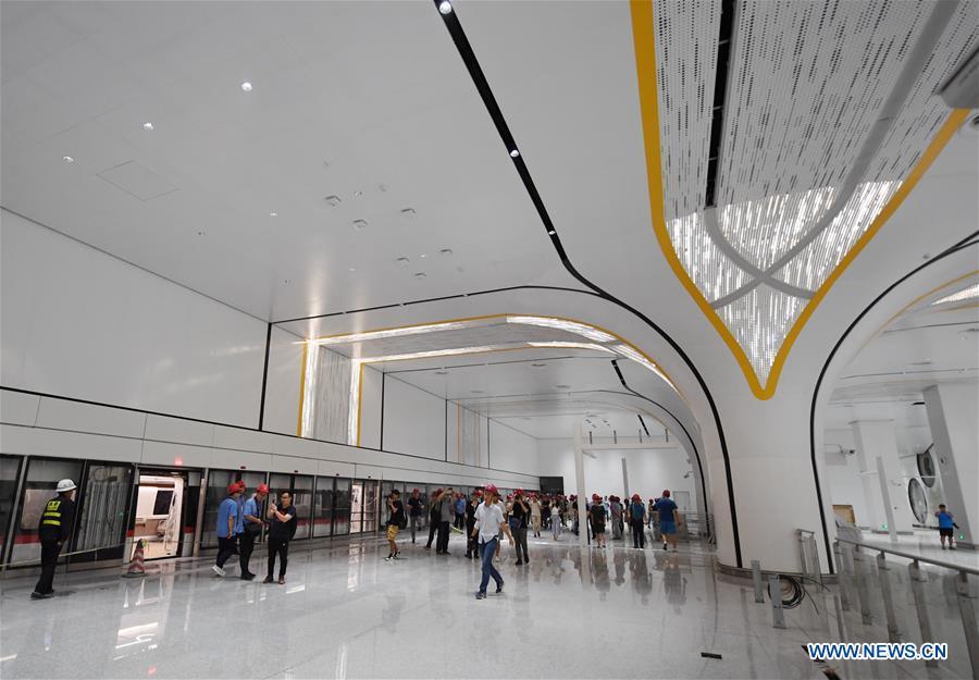 <?php echo strip_tags(addslashes(Photo taken on June 15, 2019 shows a station of a new airport subway line at Beijing Daxing International Airport in Beijing, capital of China. Self-driving trains for the subway line connecting downtown Beijing with its new international airport started trial run Saturday, according to local authorities. Stretching 41.4 kilometers, the new line supports autopilot system and can run at a speed of 160 km per hour, with as many as 448 passengers, according to Beijing Major Projects Construction Headquarters Office. (Xinhua/Zhang Chenlin))) ?>