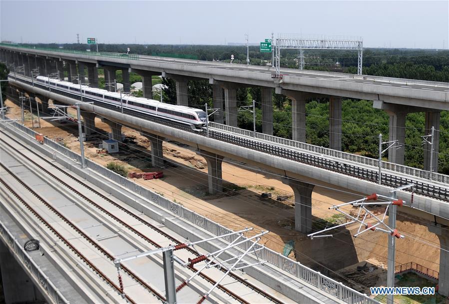 <?php echo strip_tags(addslashes(A train runs on a new airport subway line for trial in Beijing, capital of China, June 15, 2019. Self-driving trains for the subway line connecting downtown Beijing with its new international airport started trial run Saturday, according to local authorities. Stretching 41.4 kilometers, the new line supports autopilot system and can run at a speed of 160 km per hour, with as many as 448 passengers, according to Beijing Major Projects Construction Headquarters Office. (Xinhua/Zhang Chenlin))) ?>