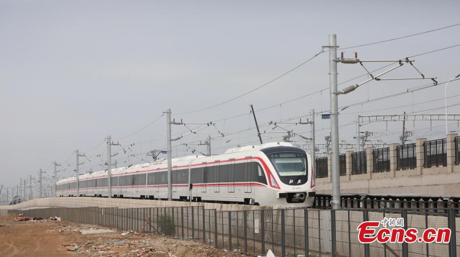A train runs on a new airport subway line for trial in Beijing, capital of China, June 15, 2019. Self-driving trains for the subway line connecting downtown Beijing with its new international airport started trial run Saturday, according to local authorities. Stretching 41.4 kilometers, the new line supports autopilot system and can run at a speed of 160 km per hour, with as many as 448 passengers, according to Beijing Major Projects Construction Headquarters Office. (Photo/VCG)