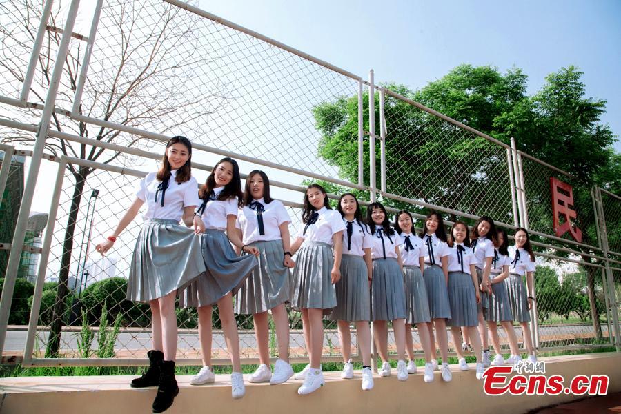 <?php echo strip_tags(addslashes(Graduates at Qinghai Nationalities University in Xining City, Qinghai Province relax into their own poses for graduation photos. The university held its graduation ceremony on Monday. (Photo provided to China News Service))) ?>