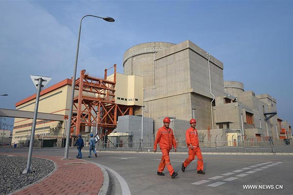 Workers walk by the No 3 and No 4 power generation units of the Hongyanhe Nuclear Power Station in Wafangdian of Dalian city, Northeast China's Liaoning province, Sept 22, 2016. (Photo/Xinhua)